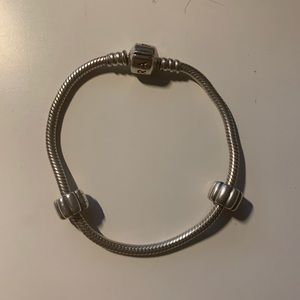 Pandora bracelet with 2 clips.